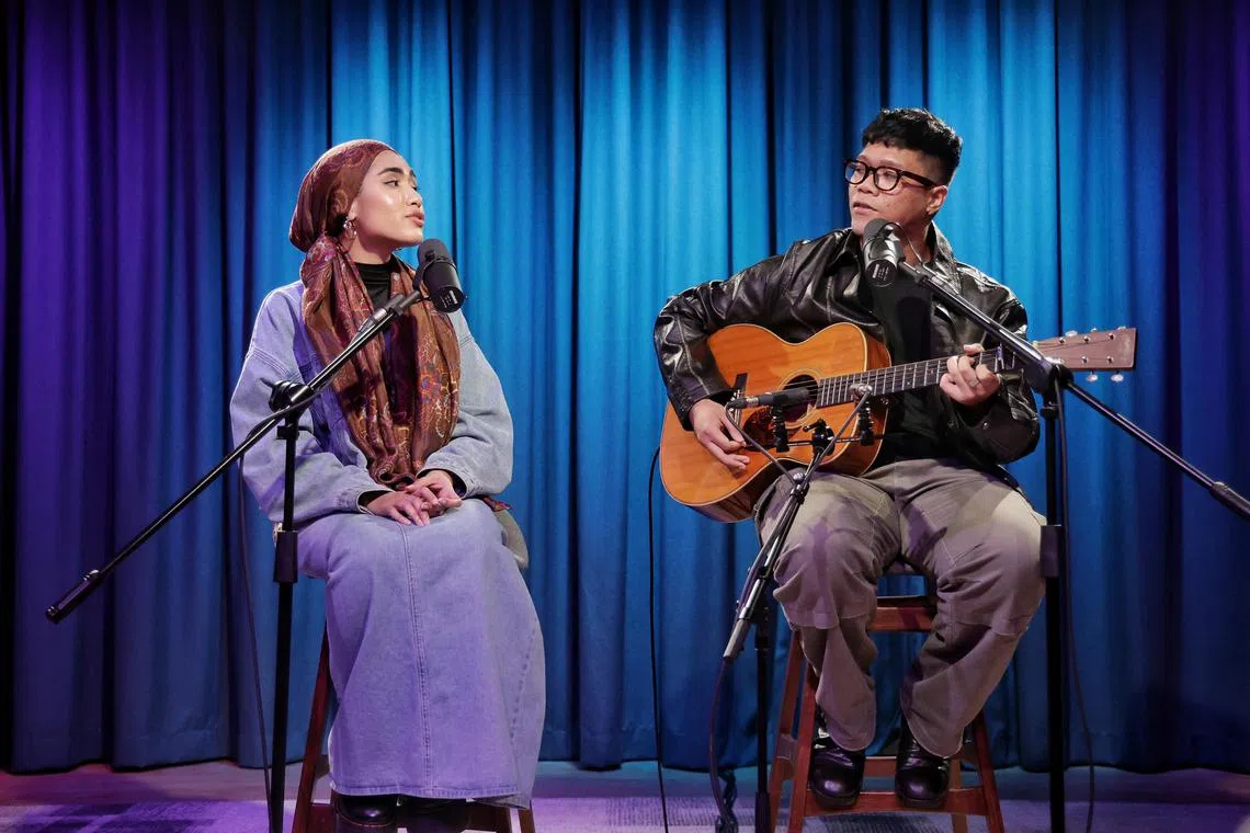 Rising Singaporean singer-songwriter Shazza (left) performing live with fellow musician Umar Sirhan during ST’s Music Lab podcast at SPH Media's Studio+65.