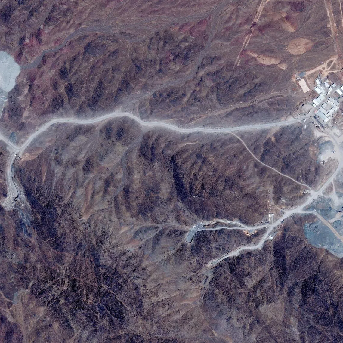 FILE PHOTO: A satellite view shows tunnel entrances at Pickaxe Mountain, of the Natanz nuclear facility, near Natanz, Iran, June 30, 2026. Vantor/Handout via REUTERS/File Photo