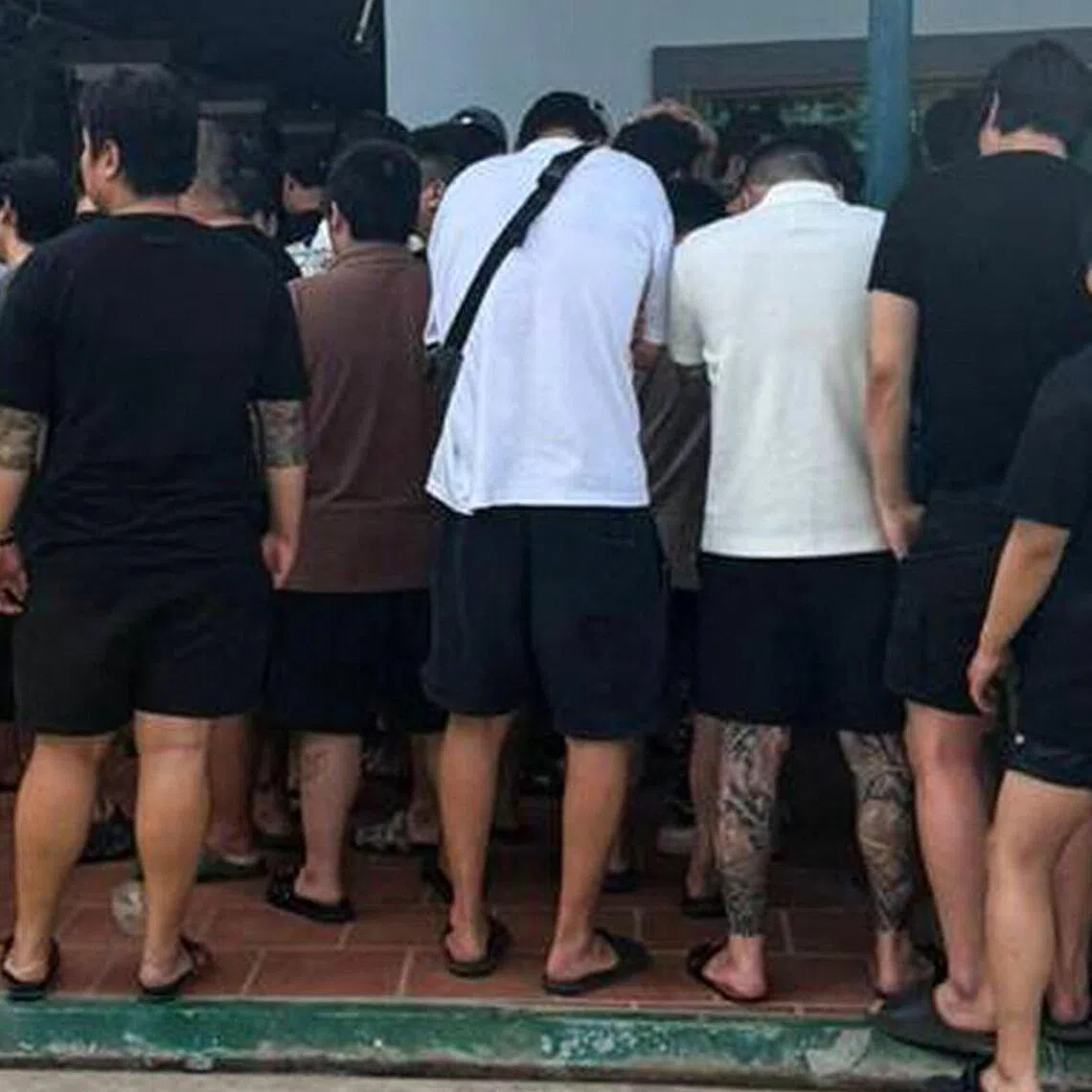 This handout photo shows some of the suspects rounded up during a raid on an online scam operation in Phnom Penh in October.
