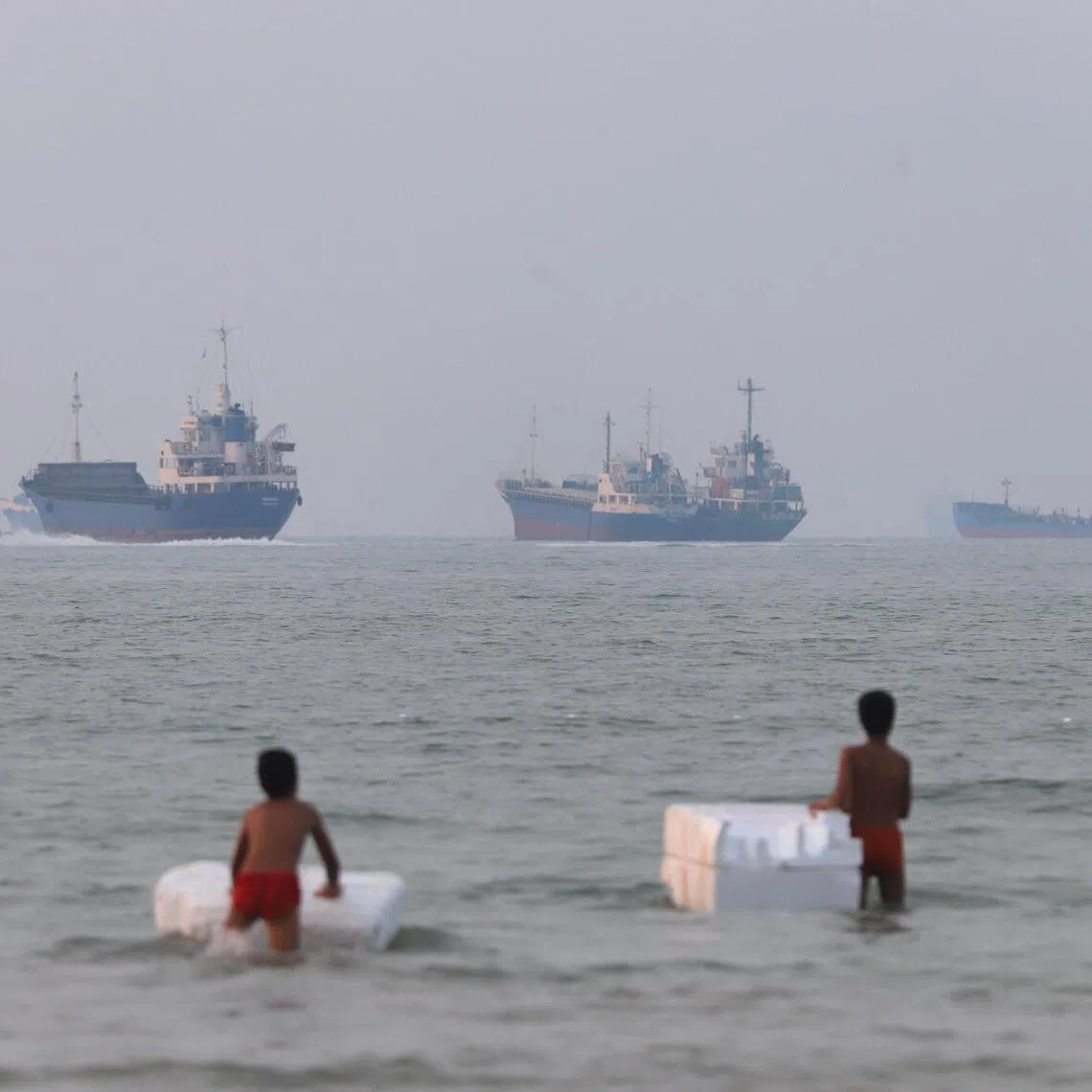 Vessels in the Strait of Hormuz near the beach of Bandar Abbas, Iran, June 30.