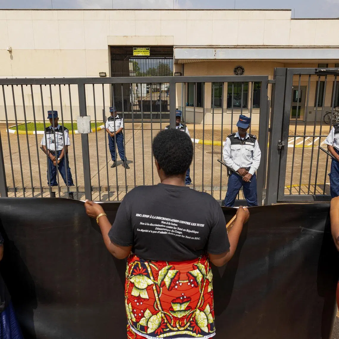 Security personnel stand guard as Congolese refugees living in Rwanda protest at various diplomatic missions, in Kigali, Rwanda January 7, 2026. REUTERS/Jean Bizimana