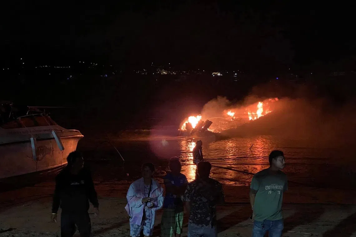 Officials worked to contain the flames by spraying water and cutting mooring lines to separate boats as far apart as possible to prevent further spread.