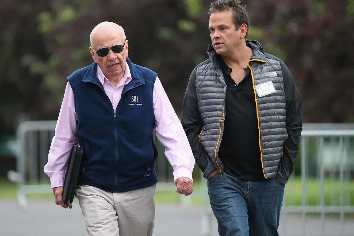 (FILES) Rupert Murdoch (L), Executive -co-Chairman of 21st Century Fox, and his son Lachlan, also co-chairman, attend the Allen & Company Sun Valley Conference on July 8, 2015 in Sun Valley, Idaho. Rupert Murdoch's children have reached a settlement in the legal dispute over control of the right-wing media mogul's companies, News Corp and Fox Corp announced on September 8, 2025. The agreement resolves litigation after siblings had contested Murdoch's effort to install as successor his son Lachlan, who shares his father's political orientation. (Photo by SCOTT OLSON / GETTY IMAGES NORTH AMERICA / AFP)