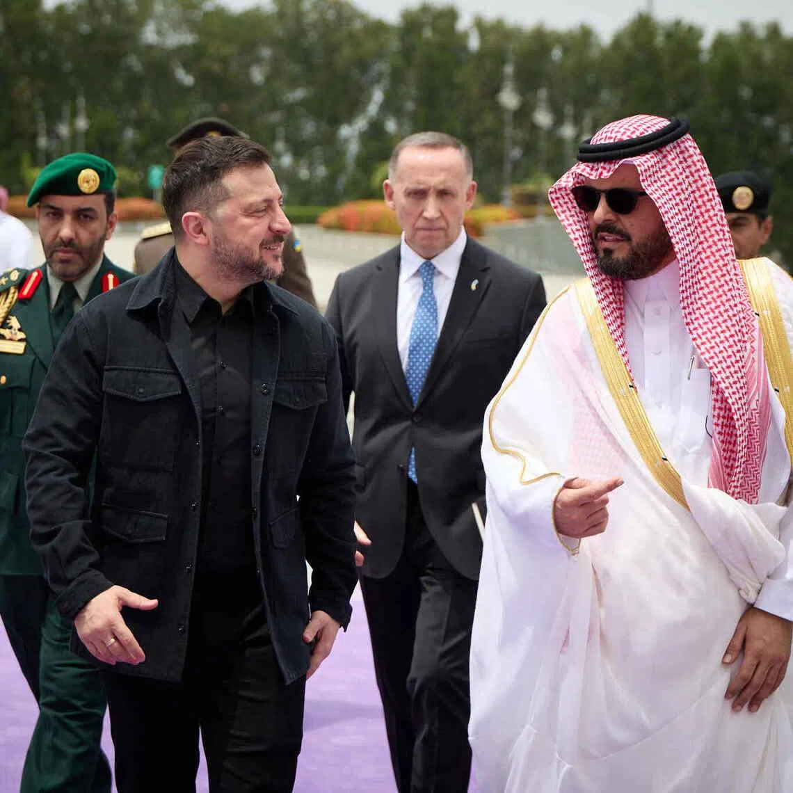 Ukrainian President Volodymyr Zelensky (left) arriving in Saudi Arabia on April 24.