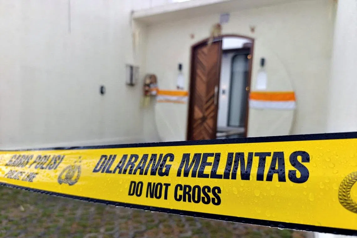 FILE PHOTO: A police line tape is seen outside the villa following an Australian man fatally shot and another Australian man injured in a shooting incident in Badung, Bali, Indonesia, June 14, 2025. REUTERS/Sultan Anshori/File Photo
