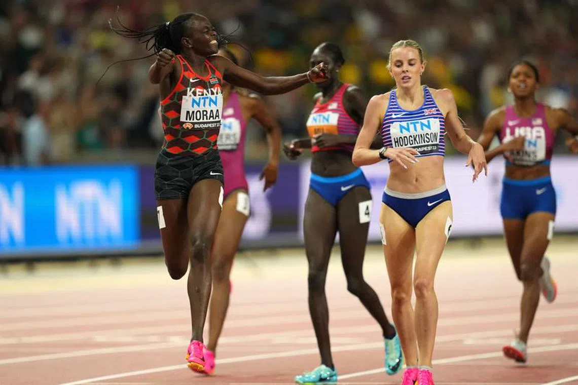 Athletics - World Athletics Championship - Women's 800m Final - Budapest, Hungary - August 27, 2023 Kenya's Mary Moraa crosses the finish line to win the final followed by Britain's Keely Hodgkinson REUTERS/Aleksandra Szmigiel