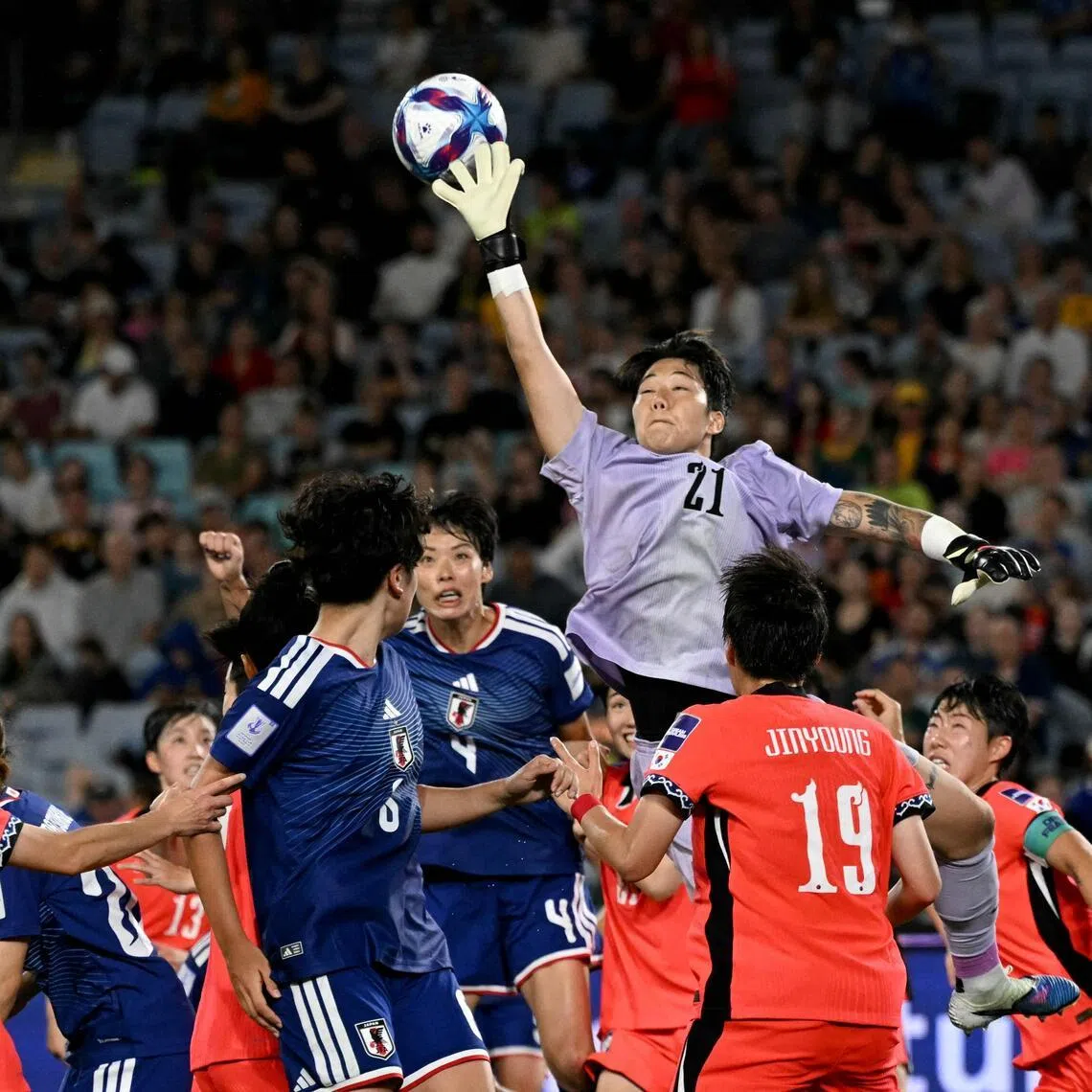 South Korea's goalkeeper Kim Min-jeong fails to hold on to a cross in the AFC Women’s Asian Cup semi-final against Japan at Stadium Australia in Sydney on March 18, 2026. Japan won 4-1.