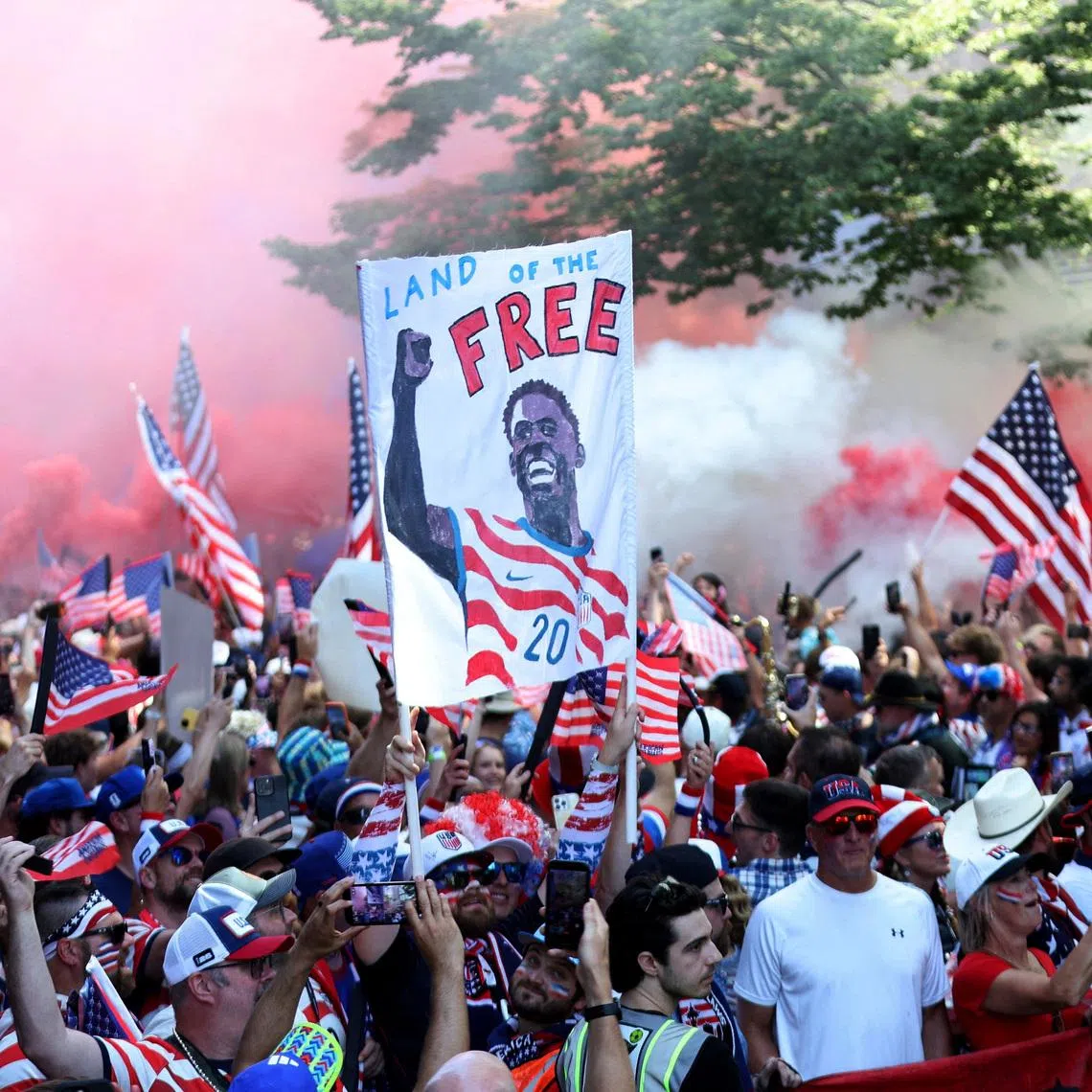 United States fans gather before the match with a Folarin Balogun banner in Seattle on July 6.