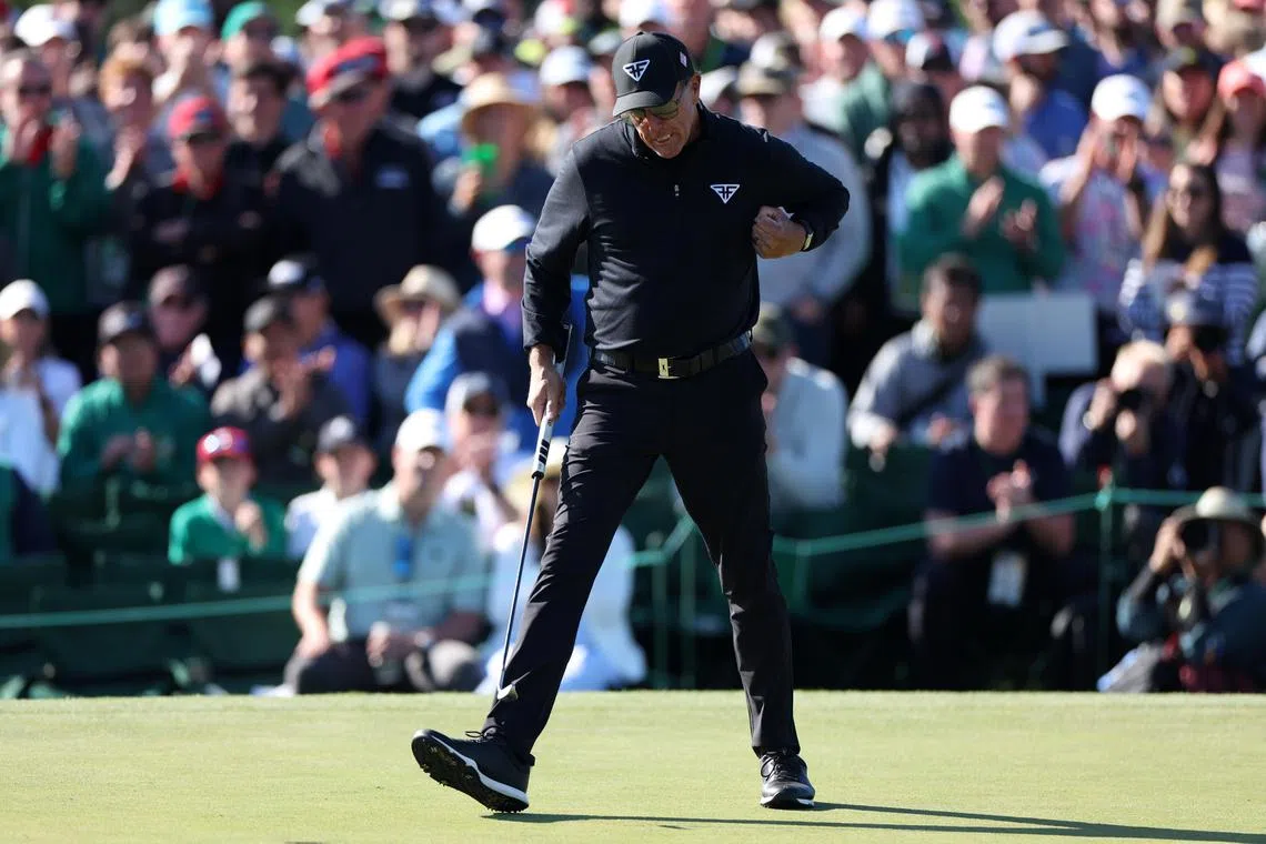 Phil Mickelson reacting after a birdie putt on the 18th hole of the final round of the Masters at Augusta. 