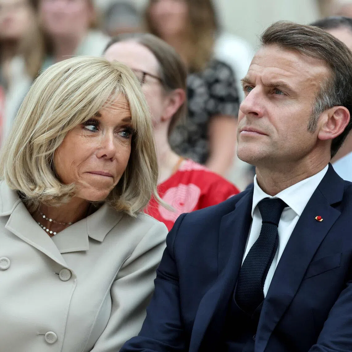 France's President Emmanuel Macron and his wife Brigitte Macron attend a ceremony during their visit to The British Museum in London on July 9, 2025, during the second day of a three-day state visit to Britain. (Photo by Ludovic MARIN / POOL / AFP)