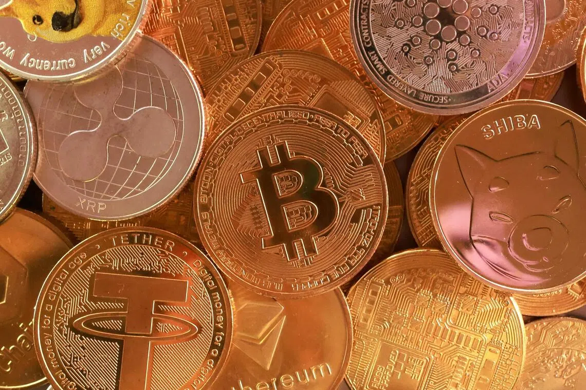A pile of assorted cryptocurrency coins.