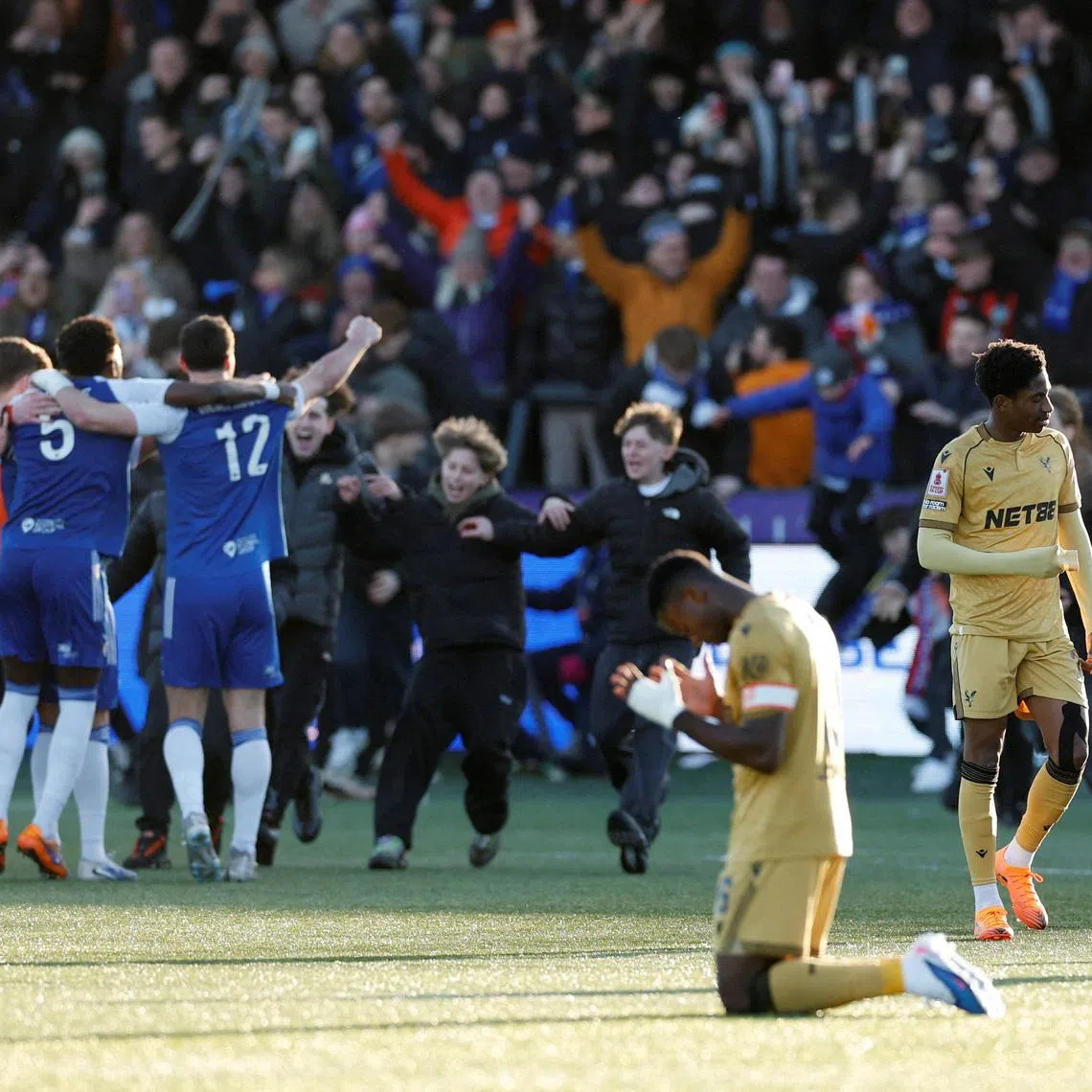 FILE PHOTO: Soccer Football - FA Cup - Third Round - Macclesfield F.C. v Crystal Palace - Moss Rose, Macclesfield, Britain - January 10, 2026 Crystal Palace's Marc Guehi looks dejected as Macclesfield F.C. players celebrate after the match Action Images via Reuters/Jason Cairnduff/File Photo