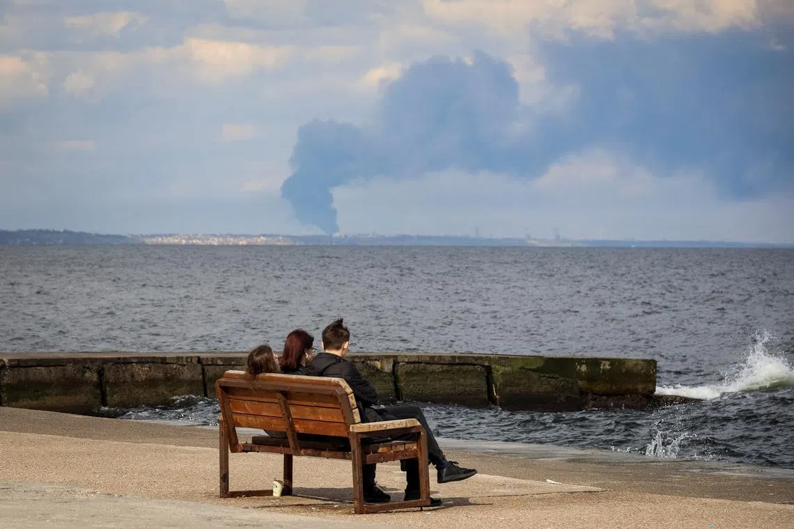 Smoke rising over the Black Sea Ukranian port of Pivdennyi (background) after a Russian missile strike on April 19.
