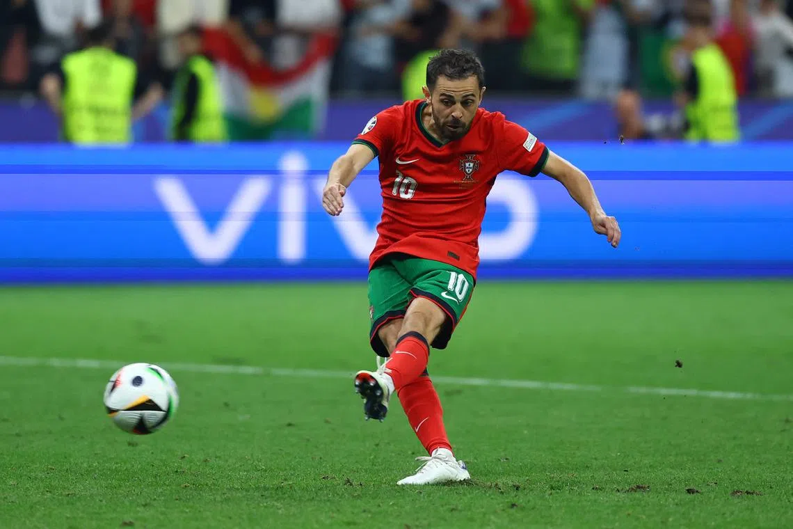 FILE PHOTO: Soccer Football - Euro 2024 - Round of 16 - Portugal v Slovenia - Frankfurt Arena, Frankfurt, Germany - July 1, 2024  Portugal's Bernardo Silva scores a penalty to win the shoot-out REUTERS/Kai Pfaffenbach/File Photo