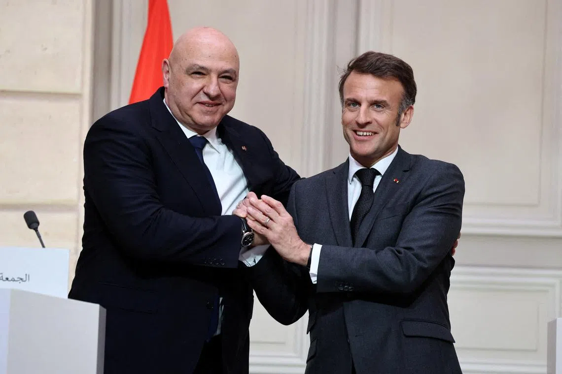 FILE PHOTO: French President Emmanuel Macron and Lebanese President Joseph Aoun shake hands during a joint press conference, at the Elysee Palace in Paris, France, March 28, 2025. REUTERS/Sarah Meyssonnier/Pool/File Photo