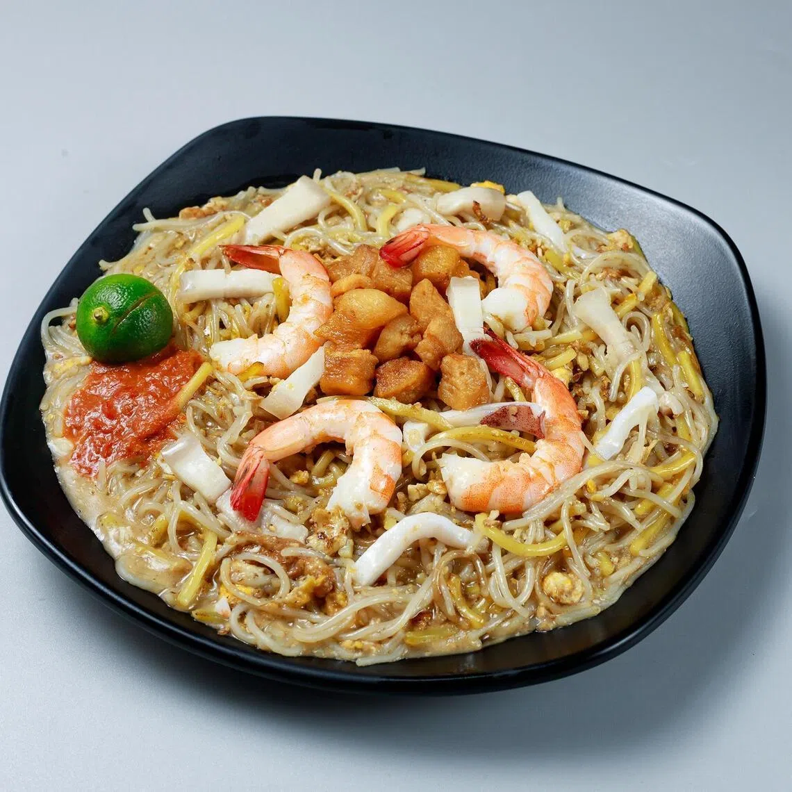 Mr Kelvin Teo, owner of The Neighbourwok which sells Hokkien mee. 
