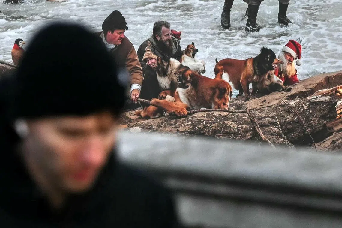 A disturbing array of figures in the festive mural included a Father Christmas with a pained expression and a beard that is half orange and half white.