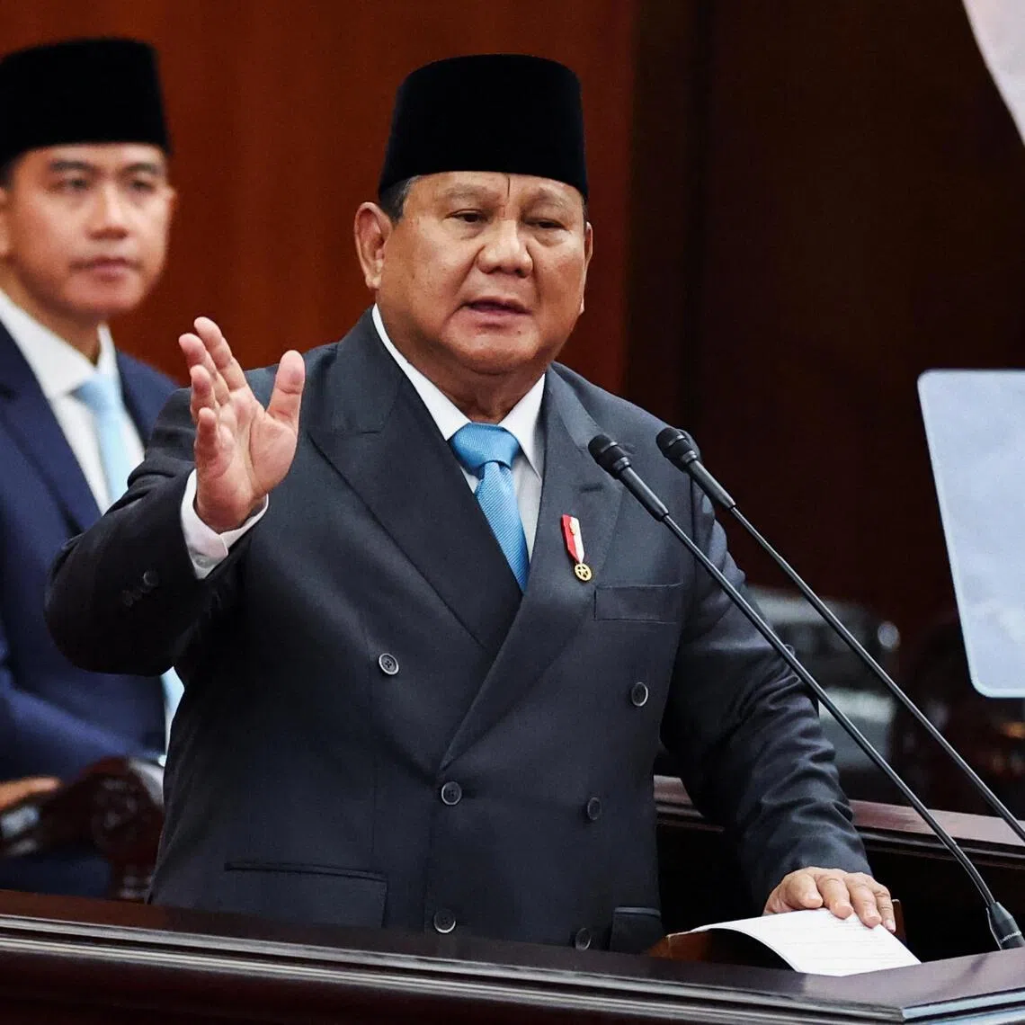 Indonesian President Prabowo Subianto delivers his speech on economic policies and the 2027 fiscal plan to parliament members at the parliament building in Jakarta, Indonesia, May 20, 2026. 