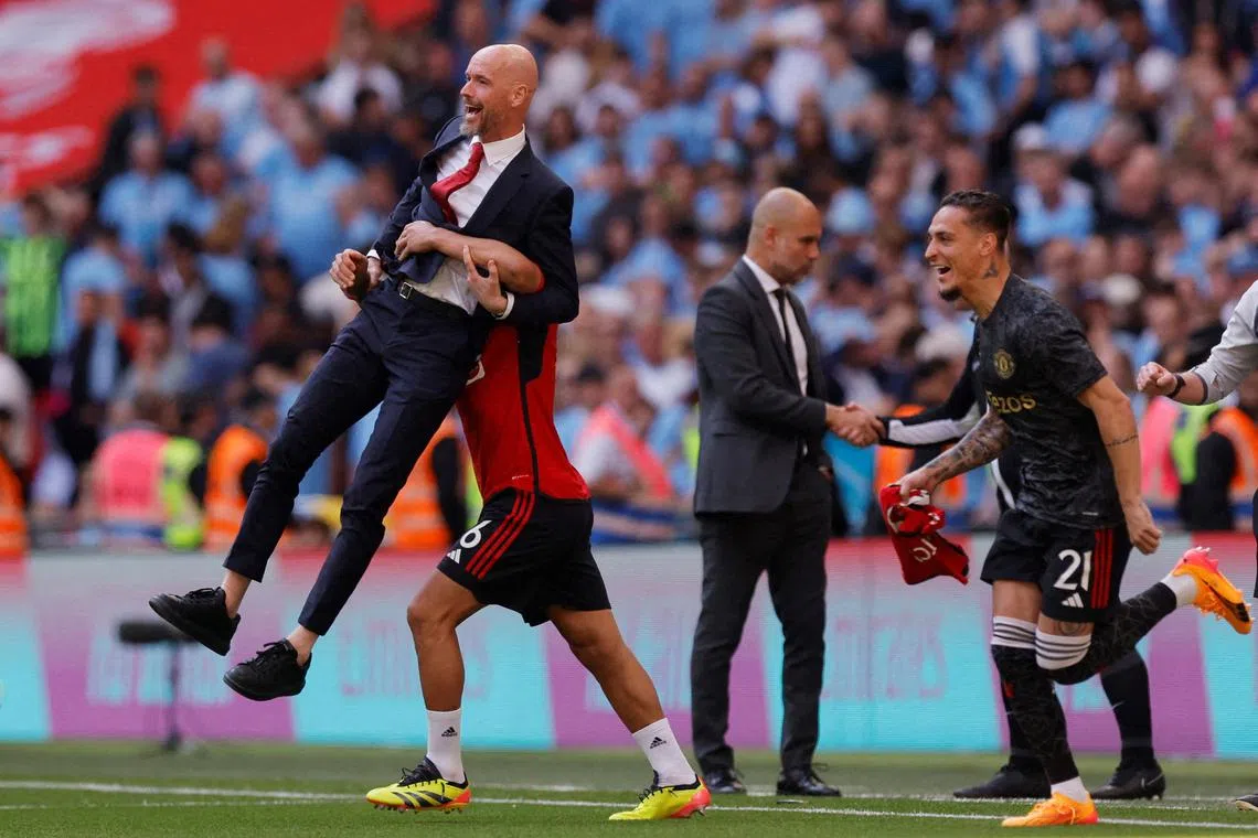 FILE PHOTO: Soccer Football - FA Cup - Final - Manchester City v Manchester United - Wembley Stadium, London, Britain - May 25, 2024 Manchester United manager Erik ten Hag and Lisandro Martinez celebrate after winning the FA Cup Action Images via Reuters/Andrew Couldridge/File Photo
