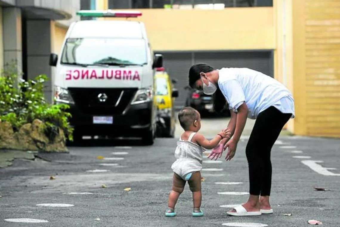 A teenage mother and her child outside a forum on teenage pregnancies organized by the Quezon City government in 2022.