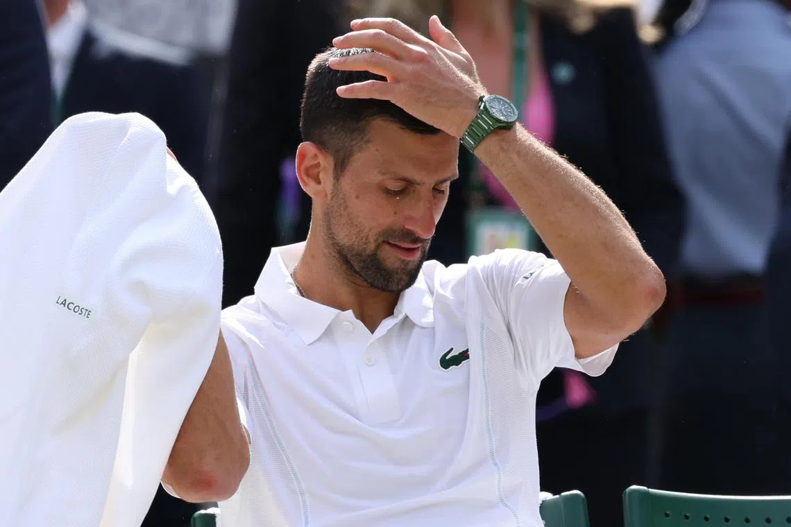 Novak Djokovic of Serbia reacting after losing the men's singles final to Carlos Alcaraz of Spain at the Wimbledon Championships on July 14.
