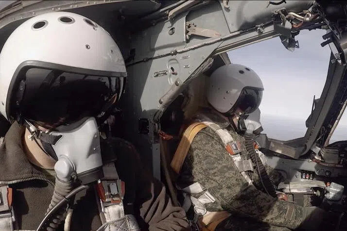 Pilots of a Russian Mikoyan MiG-31 a supersonic interceptor aircraft preparing for flight in the joint military drills with the Belarus armed forces.