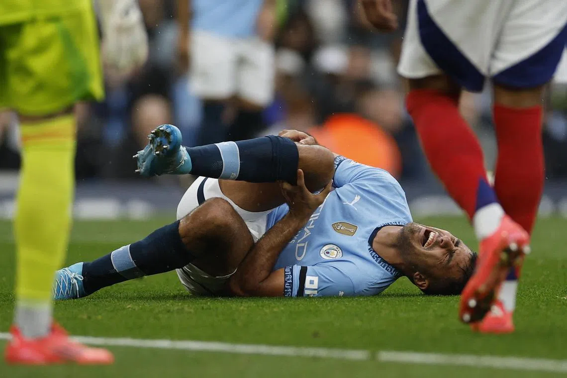 Manchester City's Rodri reacting after sustaining a suspected anterior cruciate ligament tear in his right knee during the 2-2 English Premier League draw against Arsenal on Sept 22.