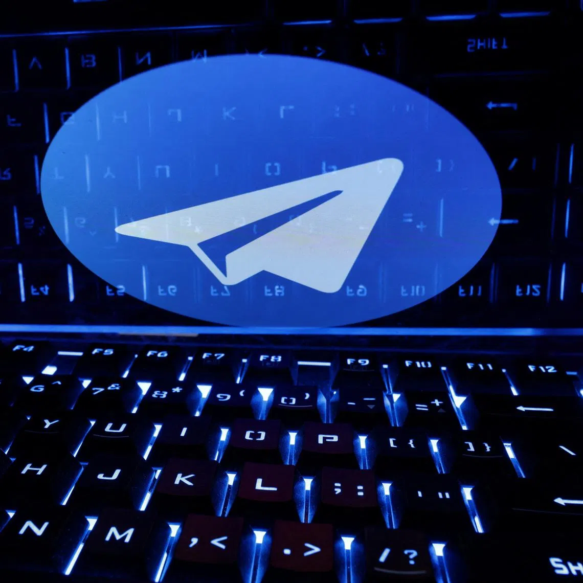 A keyboard is placed in front of a displayed Telegram logo in this illustration taken February 21, 2023. REUTERS/Dado Ruvic/Illustration