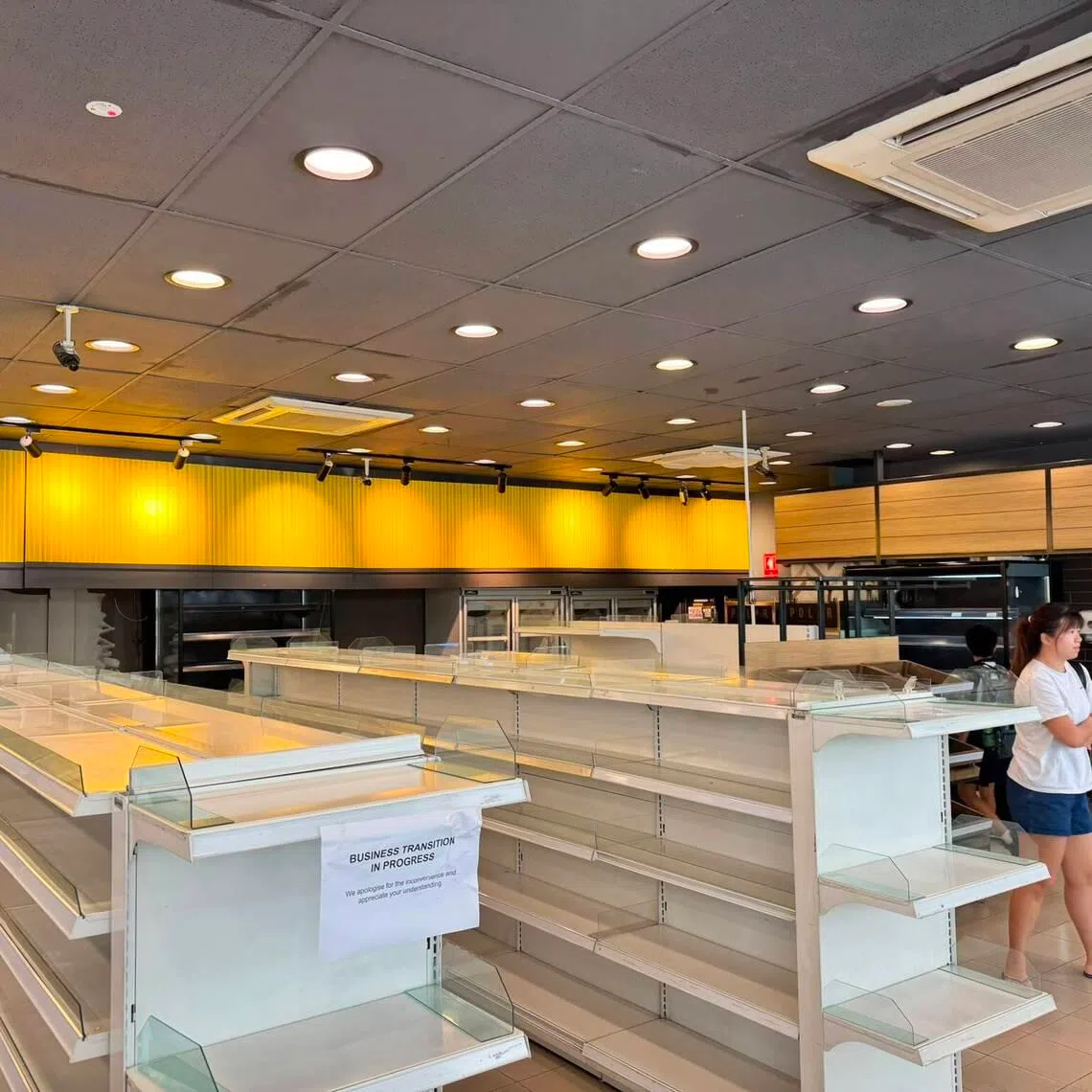 Empty shelves seen at the FairPrice convenience store at the Esso petrol station in Braddell.