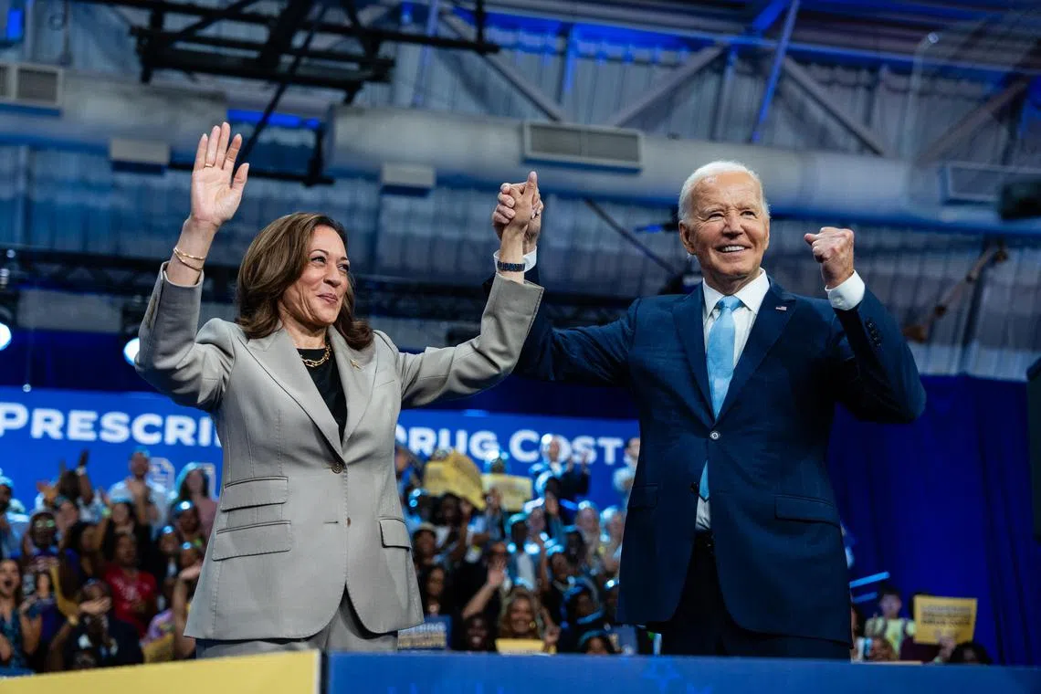 **EDS.: RETRANSMISSION TO PROVIDE ALTERNATE TONING** President Joe Biden and Vice President Kamala Harris, the Democratic presidential nominee, raise their clasped hands during a campaign event at Prince George's Community College in Largo, Md., on Thursday, Aug. 15, 2024. (Eric Lee/The New York Times)