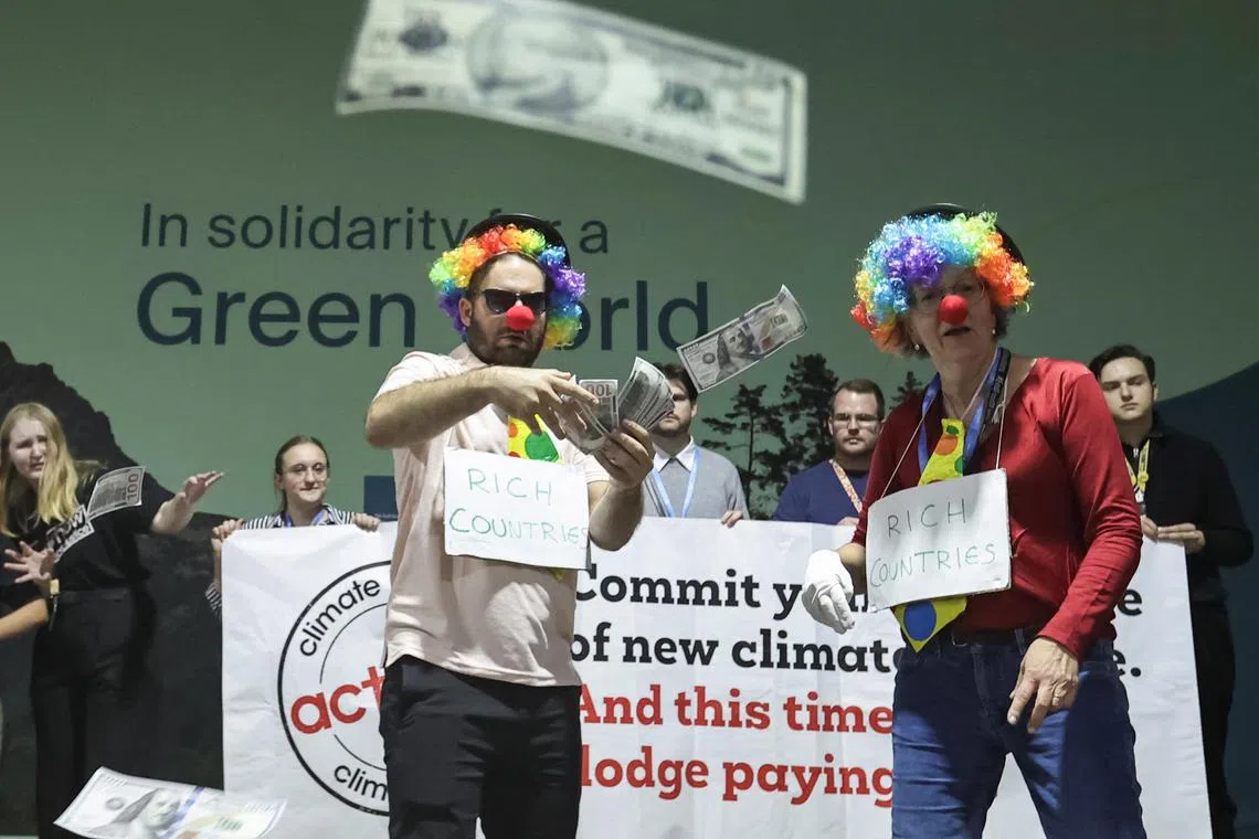 Environmental activists protest during the COP29 climate change conference in Baku, Azerbaijan on Nov 22.