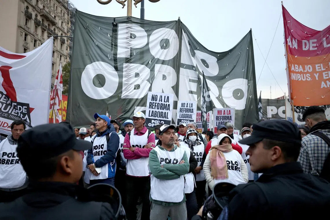 FILE PHOTO: Demonstrators protest outside the National Congress on the day of the debate on Argentina's President Javier Milei's reform bill, known as the \"omnibus bill\", in Buenos Aires, Argentina April 29, 2024. REUTERS/Agustin Marcarian/File Photo