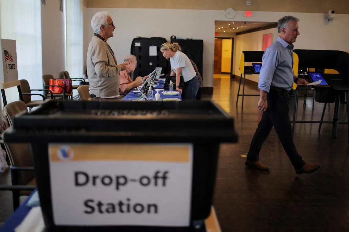 Matthew Kessler heads to a voting machine to vote on Proposition 50 at the Beverly Hills City Hall voting center in Beverly Hills, California, U.S., October 30, 2025.
