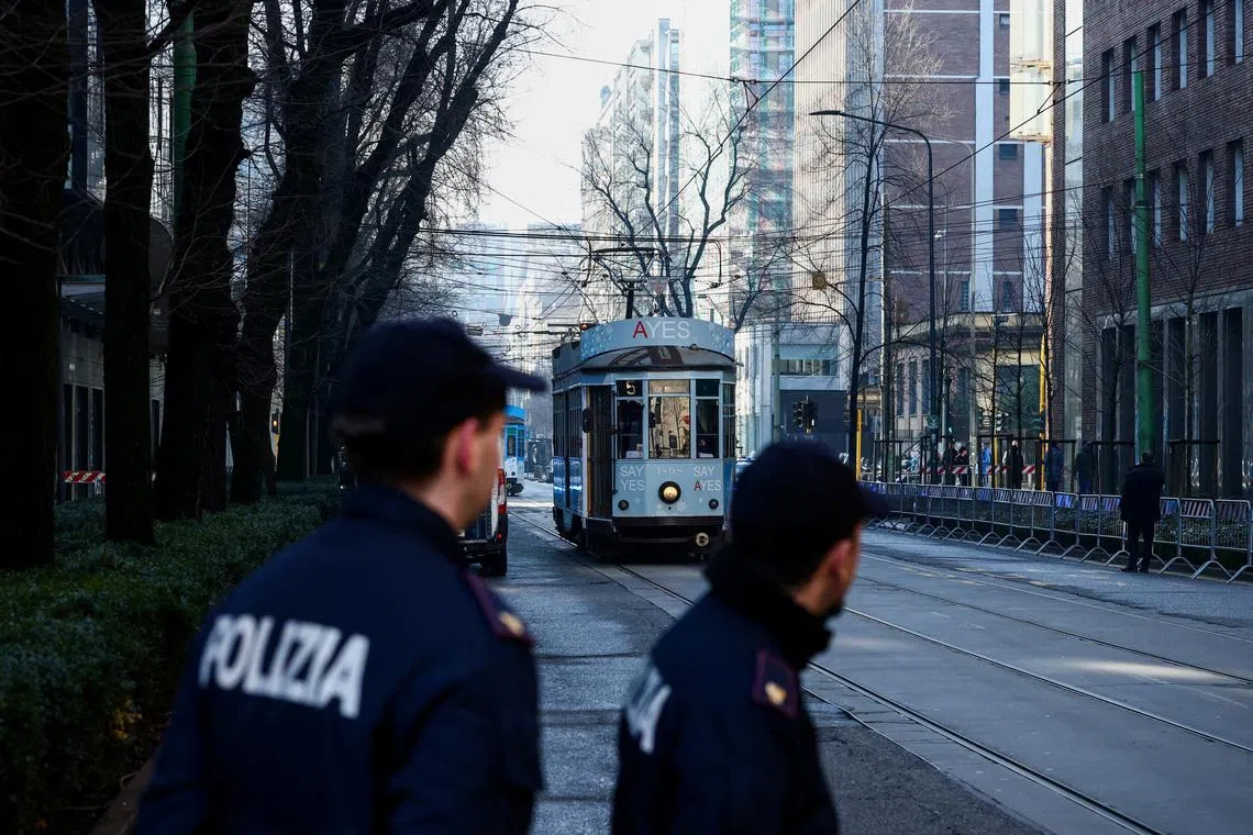 Italian police officers stand guard near the Excelsior Hotel Gallia, on the day of the expected arrival of U.S. Vice President JD Vance, ahead of the Milano Cortina 2026 Winter Olympic Games in Milan, Italy, February 5, 2026. REUTERS/Guglielmo Mangiapane