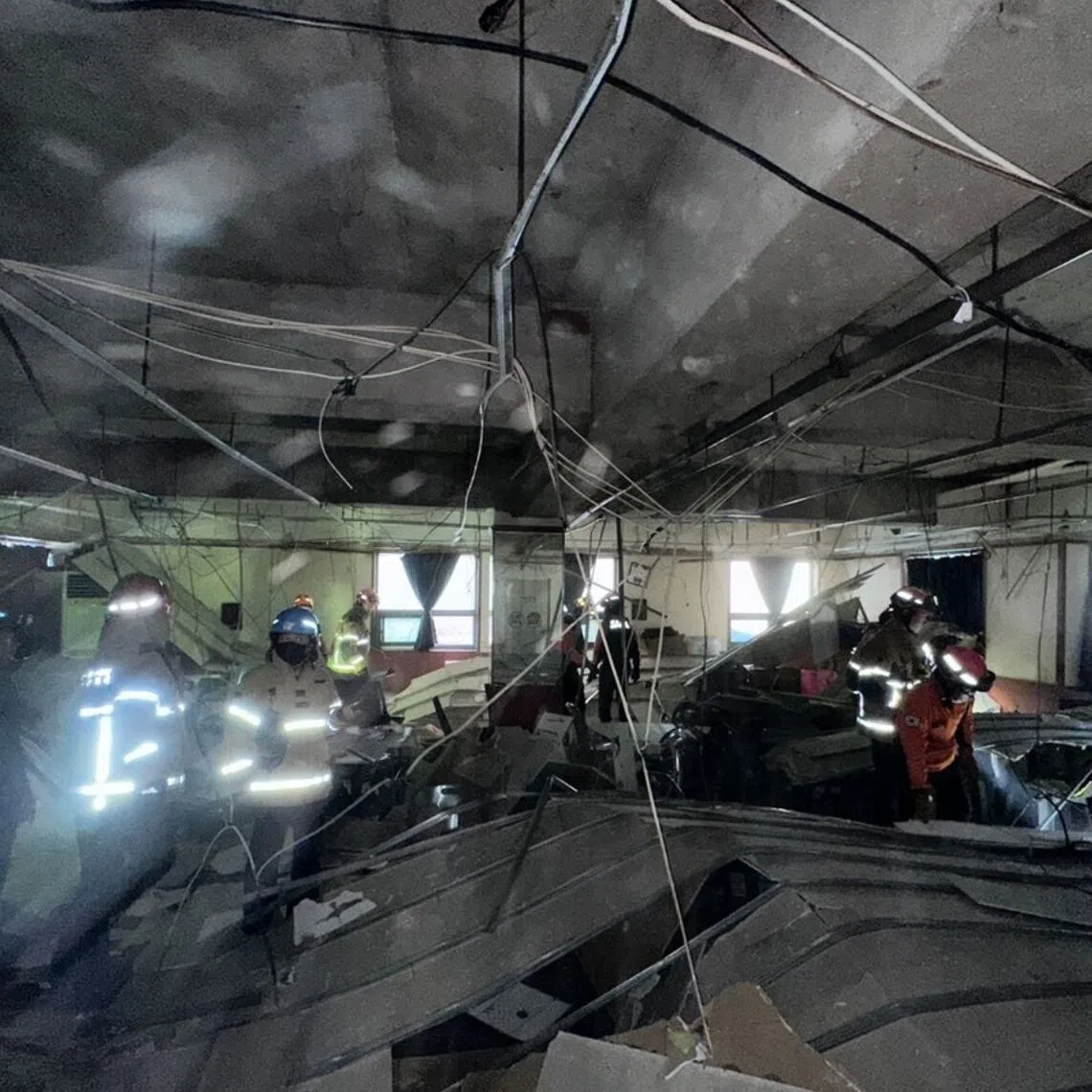 The collapse occurred on the second floor of the four-story building.
