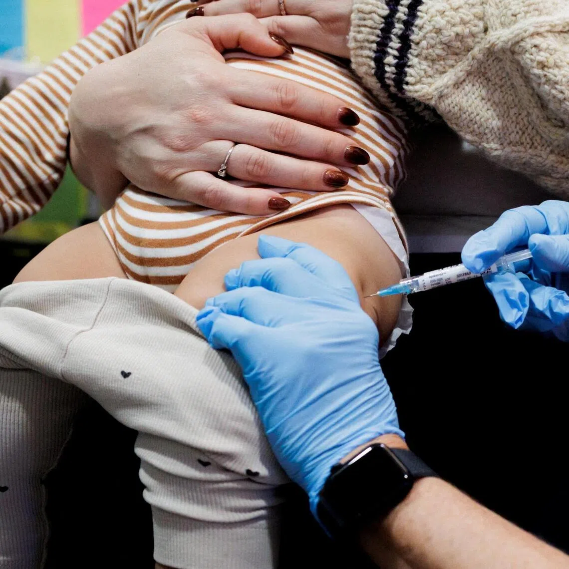 A child in the US receiving a dose of Moderna’s Spikevax Covid-19 vaccine in 2025. The Trump administration is refunding excess fees to those who were overcharged for their coverage.