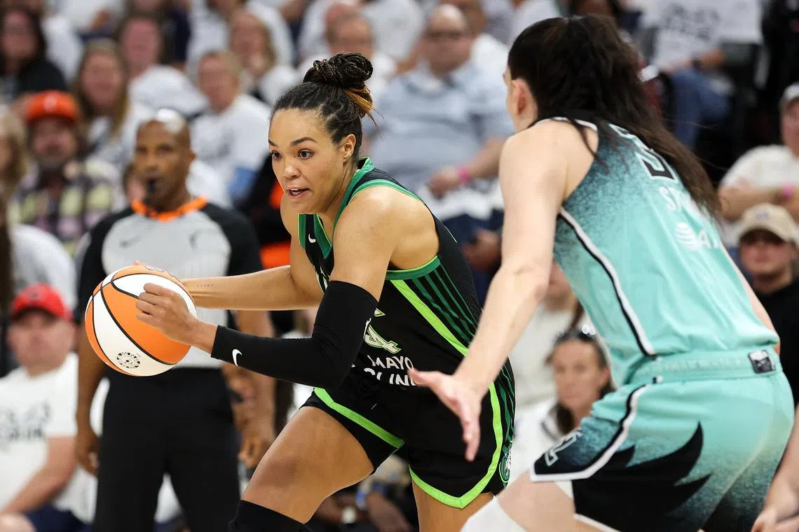 FILE PHOTO: Oct 18, 2024; Minneapolis, Minnesota, USA; Minnesota Lynx forward Napheesa Collier (24) works around New York Liberty forward Breanna Stewart (30) during the first half of game four of the 2024 WNBA Finals at Target Center. Mandatory Credit: Matt Krohn-Imagn Images/File Photo