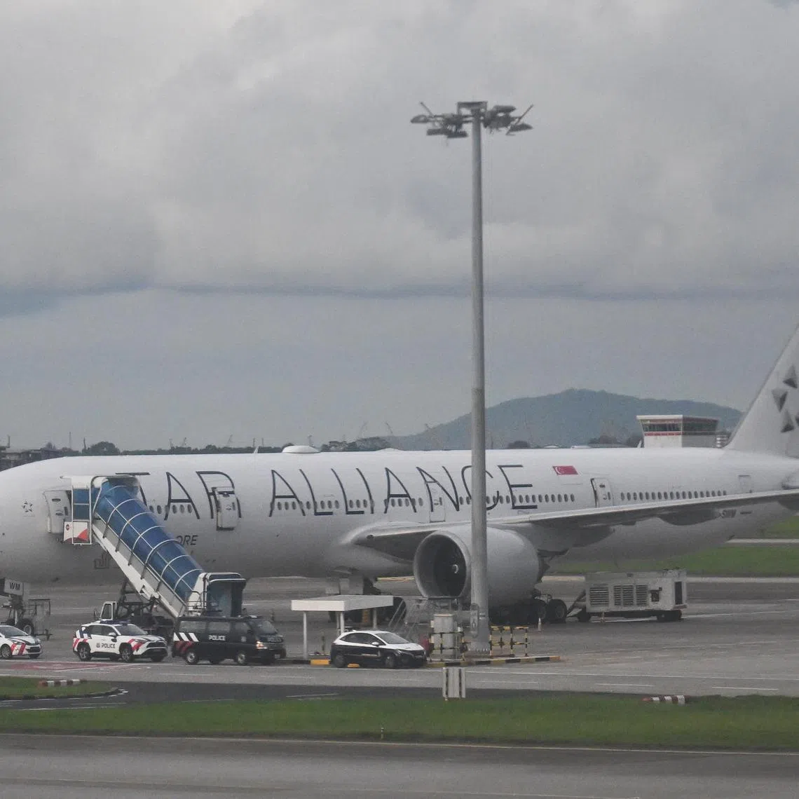 ST20240526-202401546469-Lim Yaohui-Samuel Devaraj-pixsq321/
SIA Plane, 9V-SWM, a Boeing 777-300ER, involved in SQ321 incident, returned back to Singapore at Changi Airport, photographed at 5.16pm on May 26, 2024.
The Singapore Airlines (SIA) plane which experienced severe air turbulence on May 21, resulting in one death and dozens of injuries, returned to Singapore on May 26 after being cleared for departure from Bangkok.
In response to queries from The Straits Times, an SIA spokesperson said that aircraft 9V-SWM, a Boeing 777-300ER, was flown back from Bangkok on May 26 and landed at 1.39pm.
(ST PHOTO: LIM YAOHUI)
