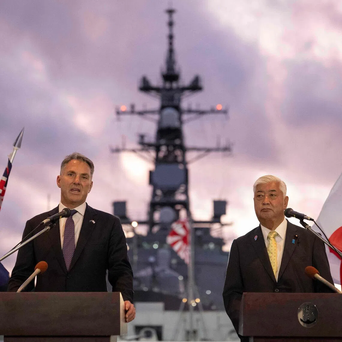 Australia's Defence Minister Richard Marles (L) and Japan's Defence Minister Gen Nakatani hold a joint press announcement aboard the Japan Maritime Self-Defense Force (JMSDF) Mogami-class stealth frigate JS Mikuma at the JMSDF naval base in Yokosuka, Kanagawa Prefecture on September 5, 2025. Japan and Australia agreed on September 5 to further deepen defence ties, a month after Canberra announced it would upgrade its navy with 11 advanced warships built by Japanese firm Mitsubishi Heavy Industries. (Photo by Yuichi YAMAZAKI / POOL / AFP)