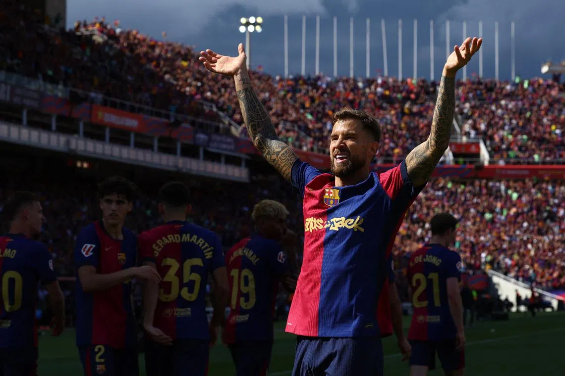 FILE PHOTO: Soccer Football - LaLiga - FC Barcelona v Real Madrid - Estadi Olimpic Lluis Companys, Barcelona, Spain - May 11, 2025 FC Barcelona's Inigo Martinez celebrates after Raphinha scores their third goal REUTERS/Albert Gea/File Photo