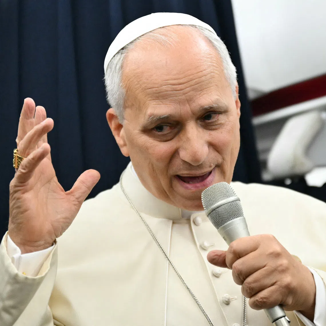 Pope Leo gives a press conference with accredited journalists on the return flight from France, on Sept 28.