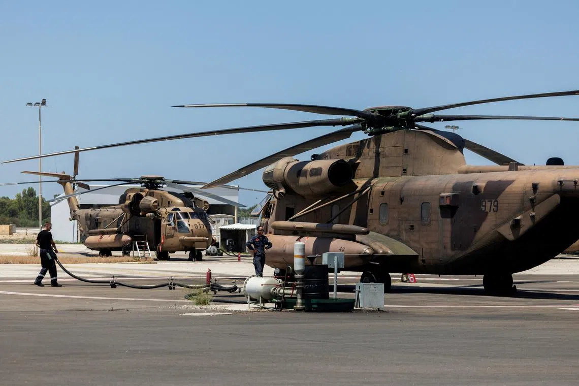 Ground crew works next to military helicopter in Tel Nof military base in central Israel June 17, 2024.  REUTERS/Ronen Zvulun/File Photo