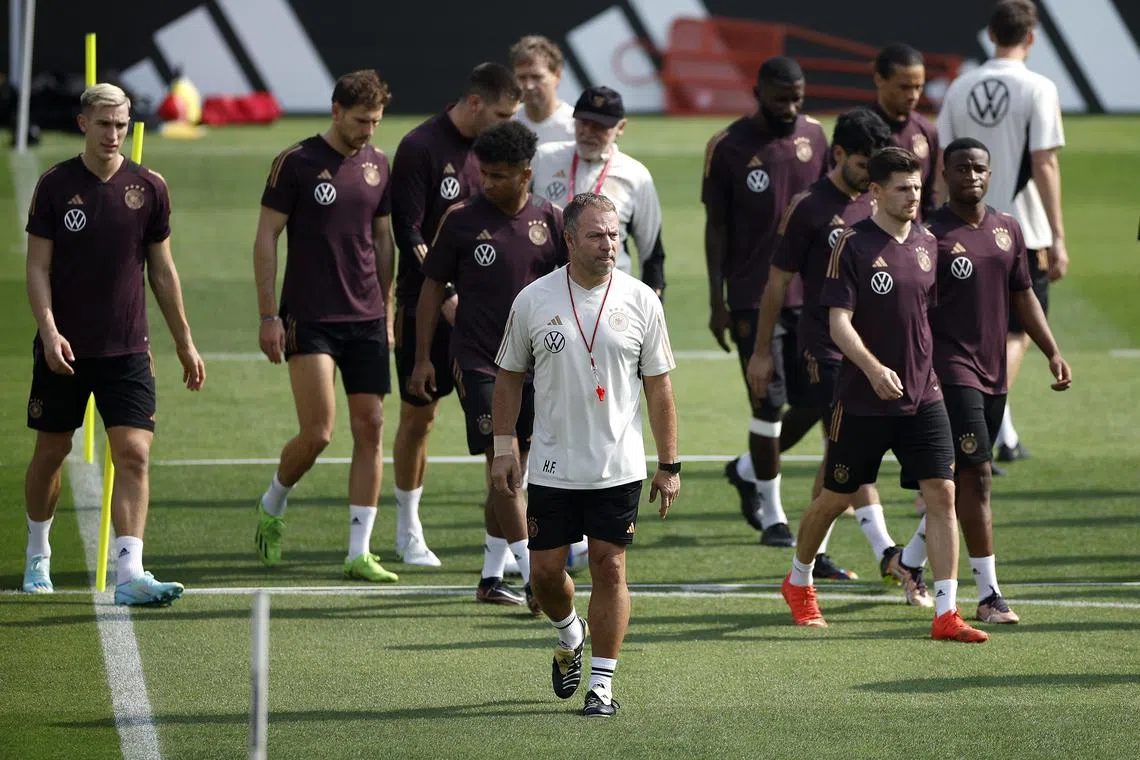 Germany coach Hansi Flick and his players during a training session on Nov 19, 2022.