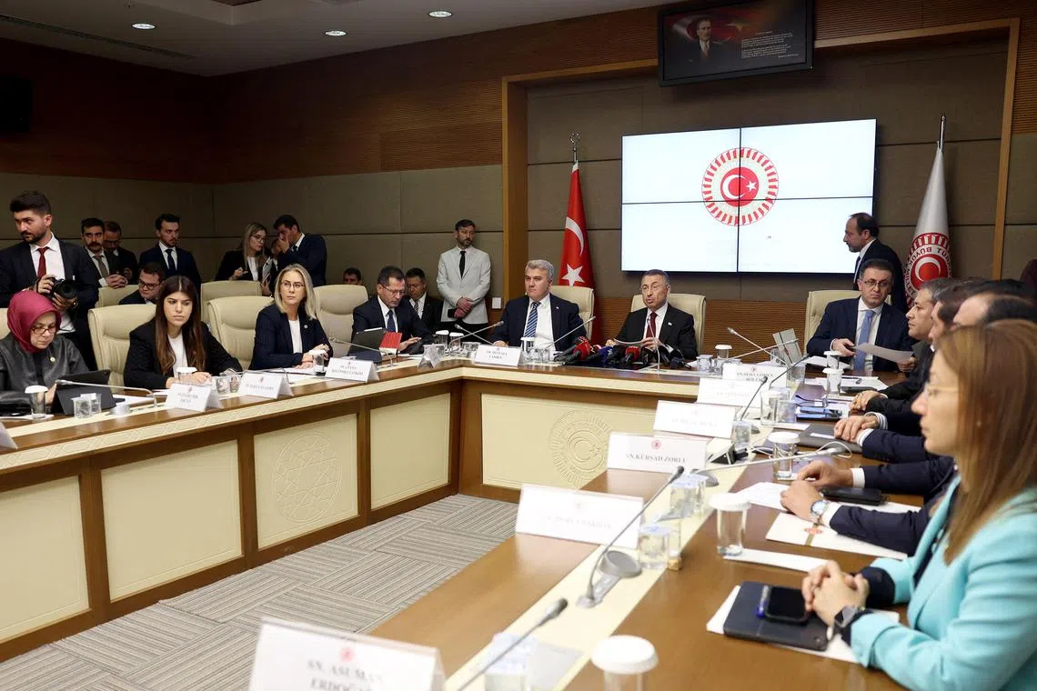 Mr Fuat Oktay (centre) chairs a foreign affairs commission session in Ankara on Sweden's Nato membership bid. 