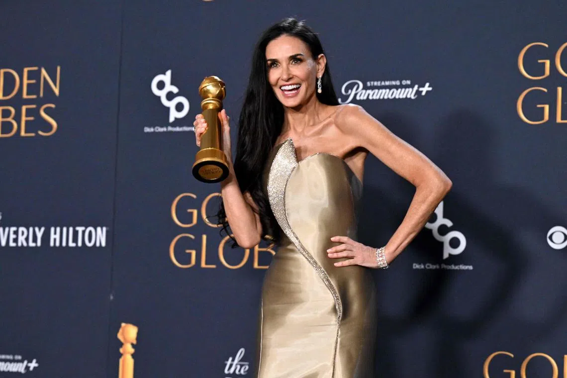 US actress Demi Moore poses with the Best Performance by a Female Actor in a Motion Picture – Musical or Comedy award for "The Substance" in the press room during the 82nd annual Golden Globe Awards at the Beverly Hilton hotel in Beverly Hills, California, on January 5, 2025. (Photo by Robyn Beck / AFP)