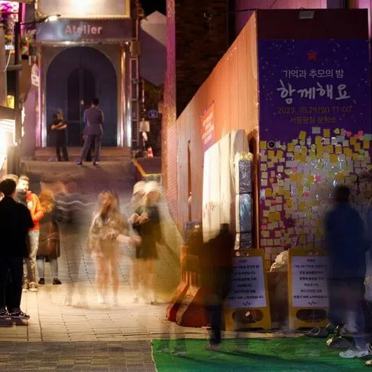 People walk through an alley in Itaewon where the Halloween crowd crush occurred.