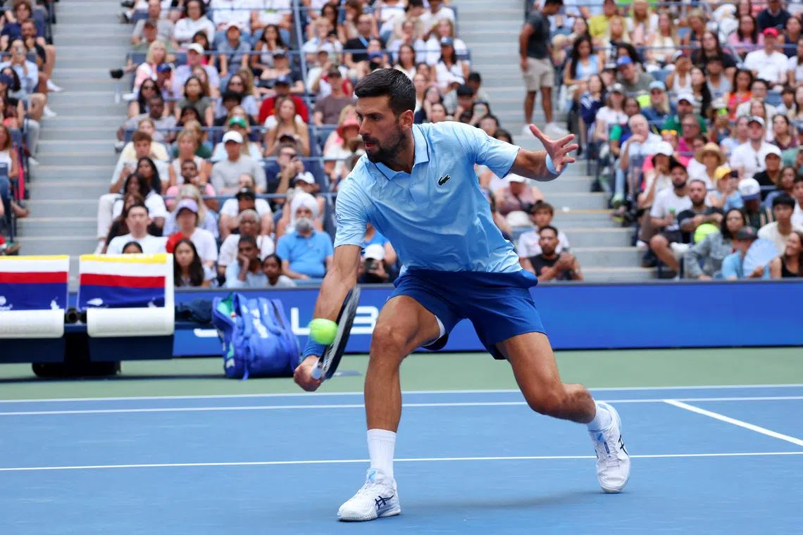FILE PHOTO: Tennis - U.S. Open - Flushing Meadows, New York, United States - August 19, 2025   Serbia's Novak Djokovic in action with Serbia's Olga Danilovic during their round of 16 mixed doubles match against Russia's Mirra Andreeva and Russia's Daniil Medvedev REUTERS/Mike Segar/ File Photo