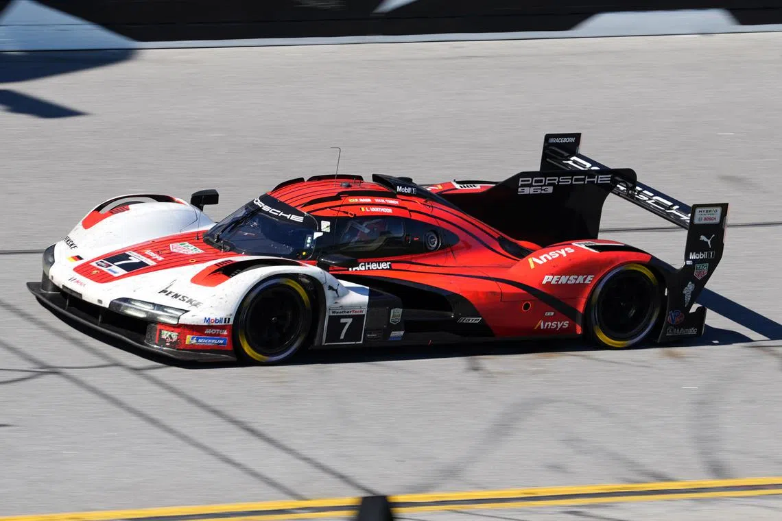 FILE PHOTO: Jan 26, 2025; Daytona Beach, FL, USA; Porsche Penske Motorsport Porsche 963 of Nick Tandy, Laurens Vanthoor, and  Felipe Nasr (7) races during the Rolex 24 at Daytona International Speedway. Mandatory Credit: Jasen Vinlove-Imagn Images/File Photo