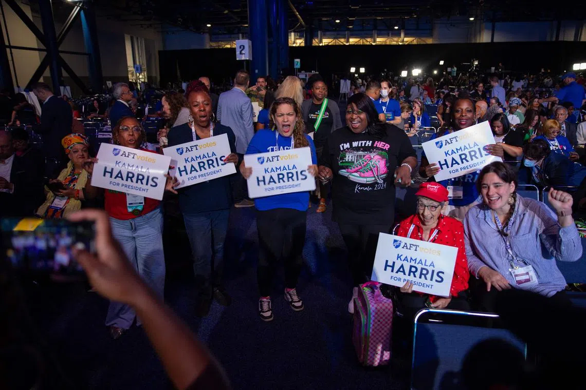 Attendees cheer during US Vice-President Kamala Harris' speech at the American Federation of Teachers' 88th National Convention on July 25 in Houston, Texas.