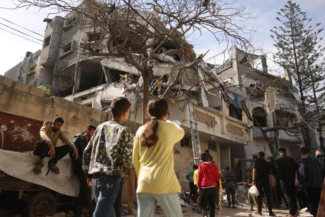 Palestinians checking the damage following overnight Israeli air strikes on a residential neighbourhood in the northern Gaza Strip, on April 16.